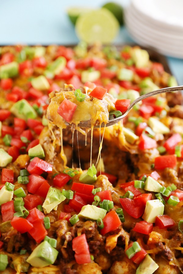 Cheesy Loaded Nacho Tater Tots – So easy, so cheesy and loaded with all the good stuff. Perfect for game day snacking! | thecomfortofcooking.com
