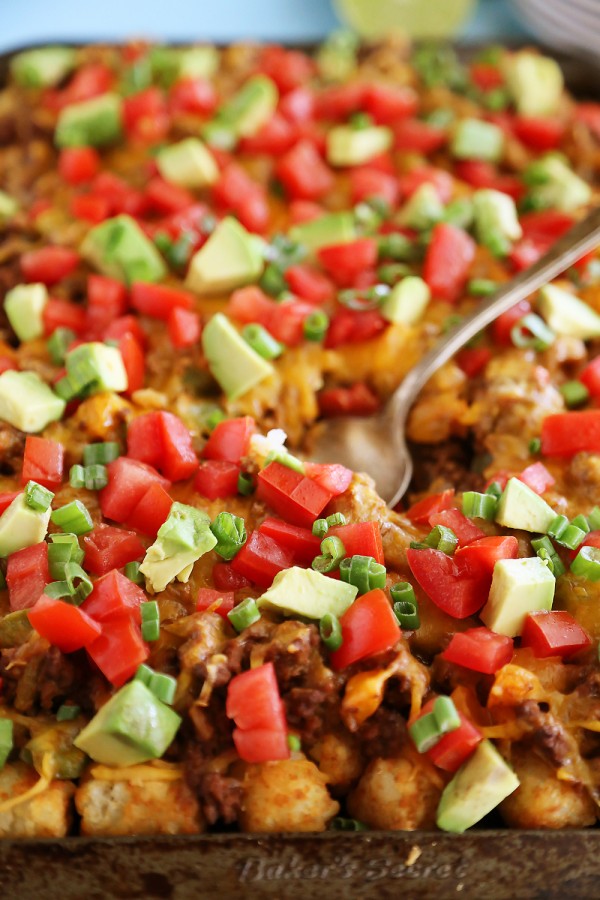 Cheesy Loaded Nacho Tater Tots – So easy, so cheesy and loaded with all the good stuff. Perfect for game day snacking! | thecomfortofcooking.com