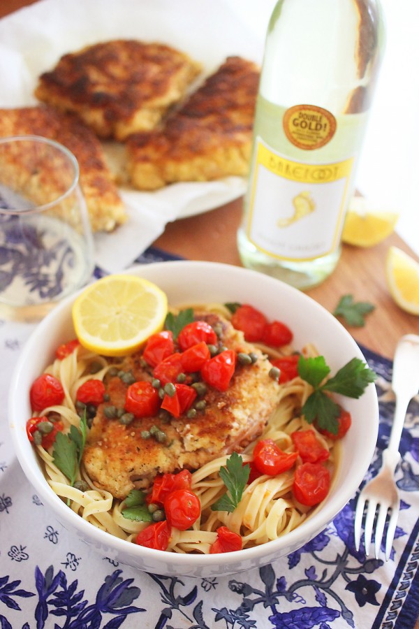 The light, lemony butter-wine sauce and tomatoes make this chicken scallopini easy but elegant, and irresistibly good! | thecomfortofcooking.com