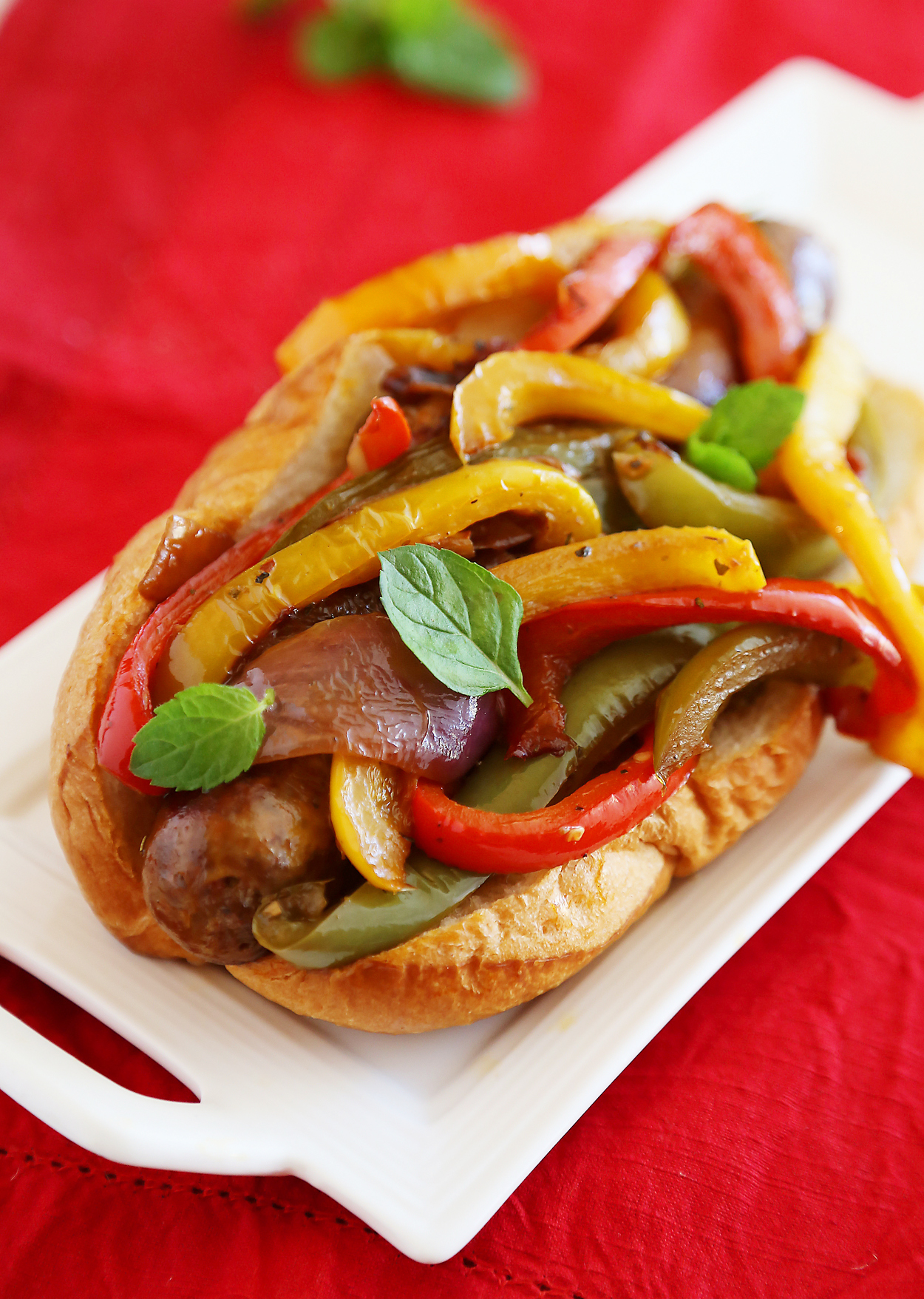 Skillet Italian Sausage, Peppers and Onions - Easy comfort food for weeknights & game days! Serve over pasta, polenta, potatoes or on warm crusty rolls. Thecomfortofcooking.com