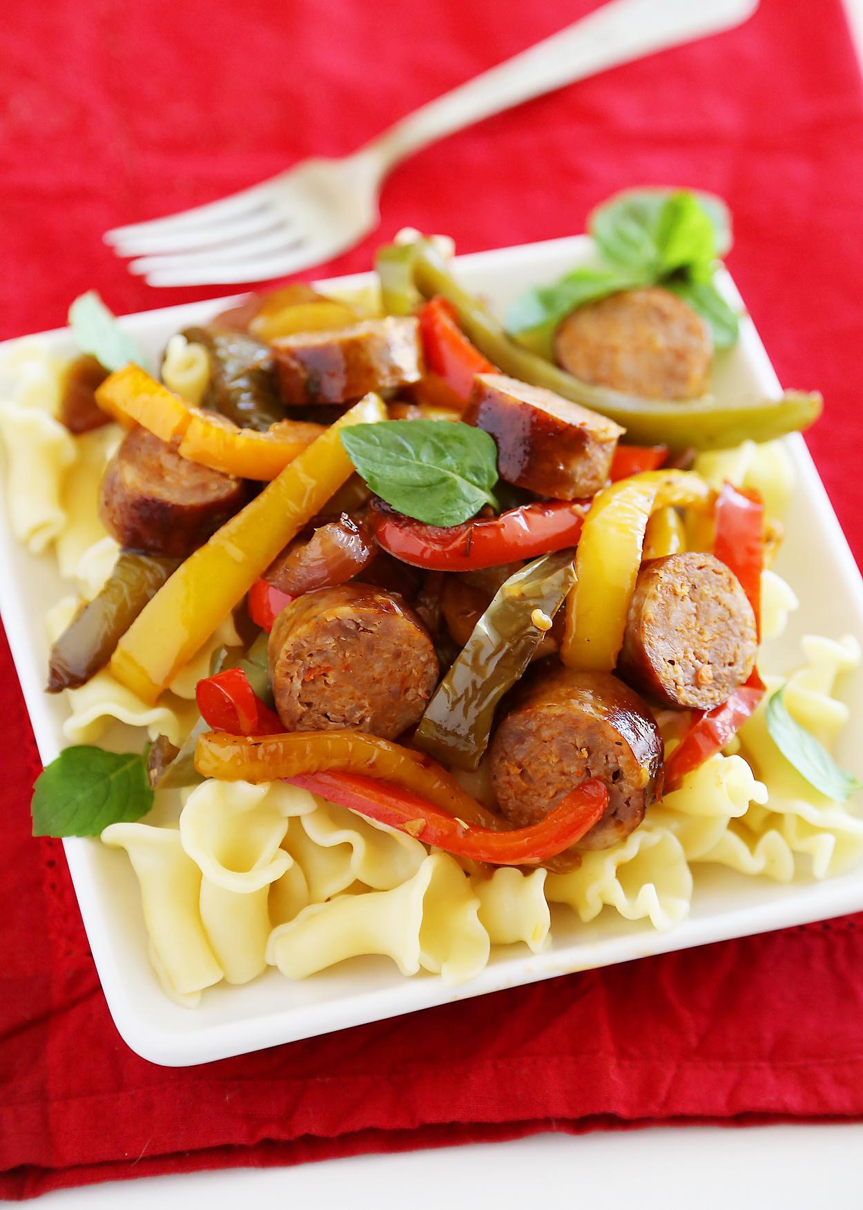 Skillet Italian Sausage, Peppers and Onions - Easy comfort food for weeknights & game days! Serve over pasta, polenta, potatoes or on warm crusty rolls. Thecomfortofcooking.com