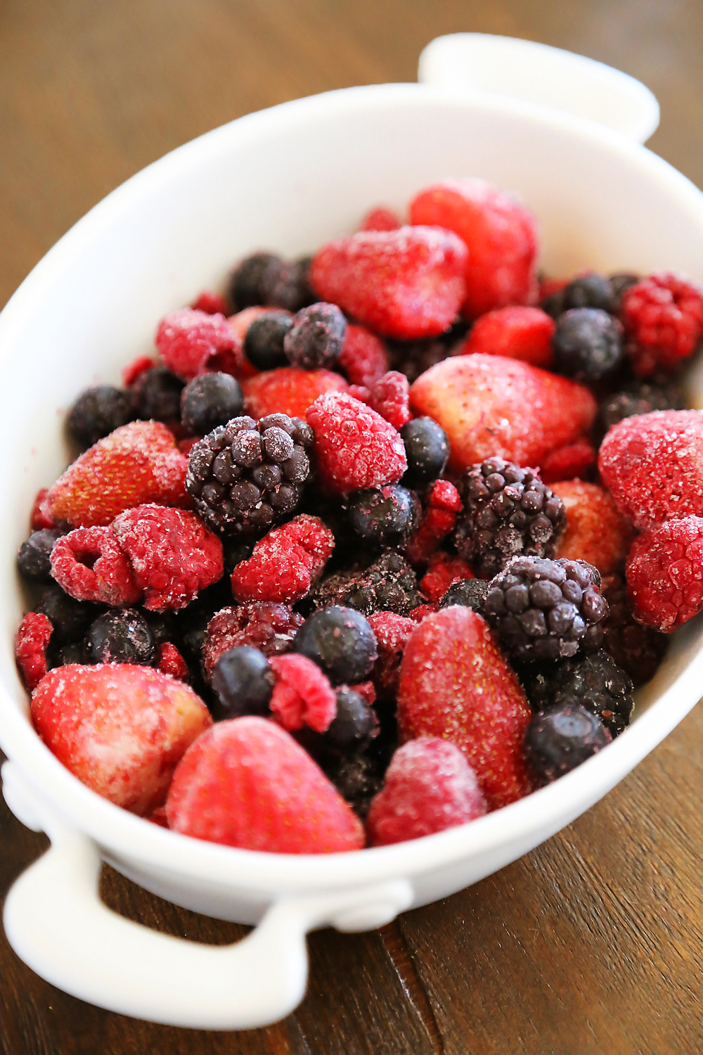 Warm Berry Crisp for Two – Small batch spin on a classic mixed berry crisp. Serve with vanilla ice cream or whipped cream! Thecomfortofcooking.com