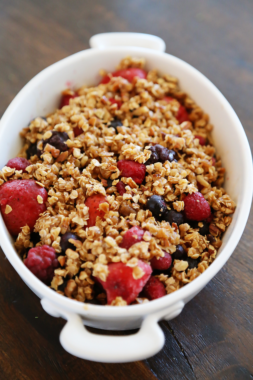 Warm Berry Crisp for Two – Small batch spin on a classic mixed berry crisp. Serve with vanilla ice cream or whipped cream! Thecomfortofcooking.com