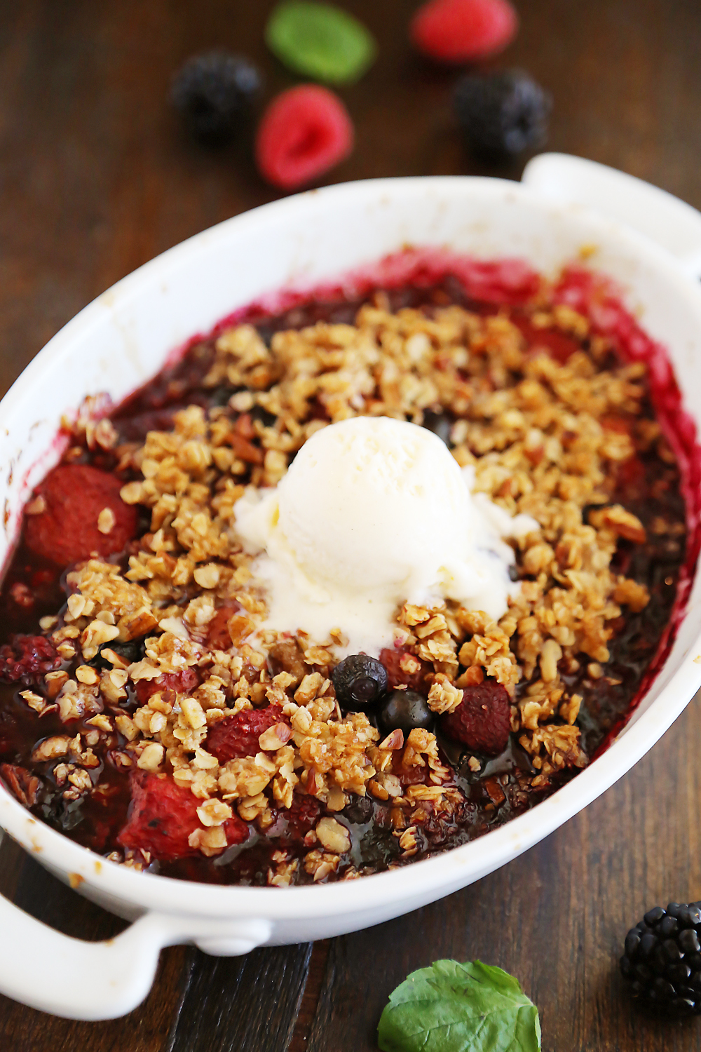 Warm Berry Crisp for Two – Small batch spin on a classic mixed berry crisp. Serve with vanilla ice cream or whipped cream! Thecomfortofcooking.com