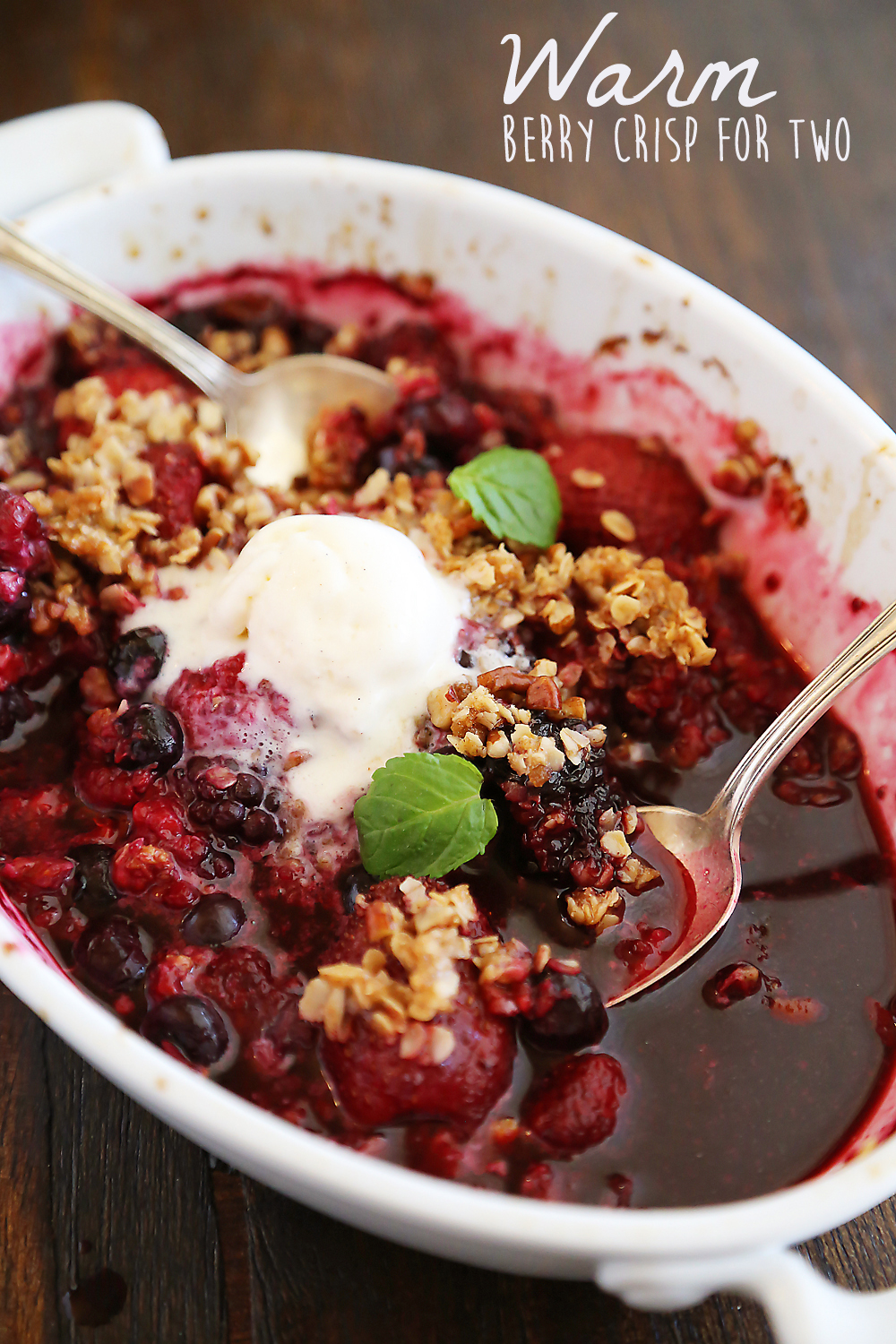 Warm Berry Crisp for Two – Small batch spin on a classic mixed berry crisp. Serve with vanilla ice cream or whipped cream! Thecomfortofcooking.com