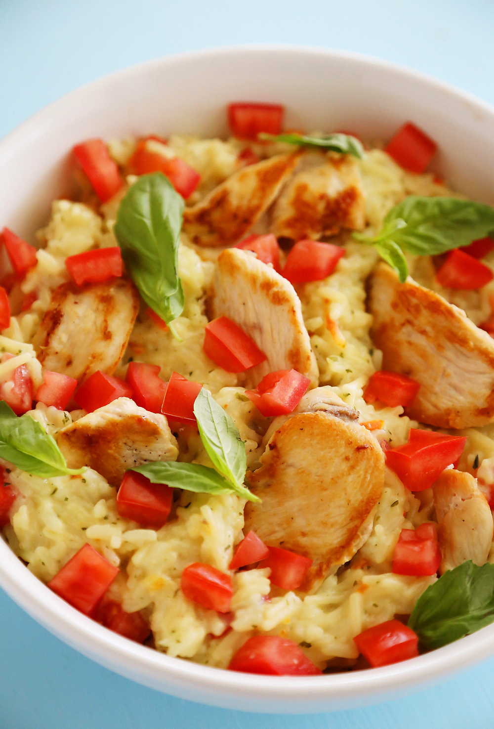 Creamy Bruschetta Chicken and Rice – Hearty, healthy and super quick for family dinners. This recipe is a keeper! | thecomfortofcooking.com