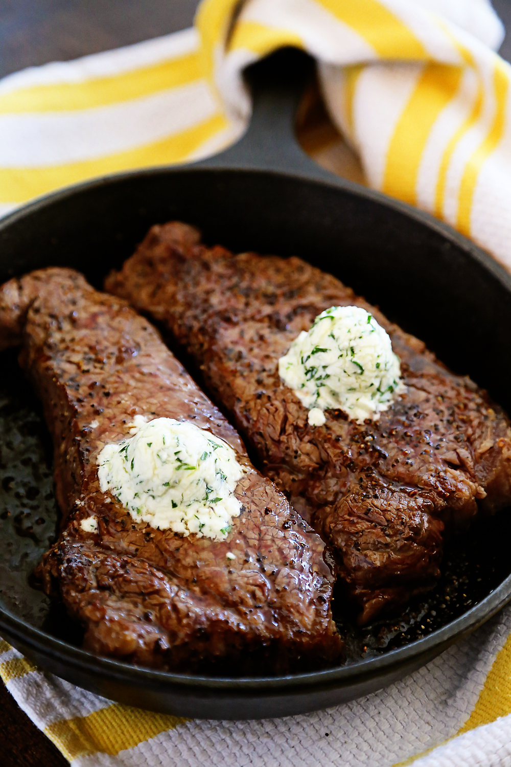 Skillet Steaks with Gorgonzola Herb Butter – Best steak we’ve ever cooked at home! Sizzle in a skillet + top with a creamy gorgonzola herb butter. | thecomfortofcooking.com