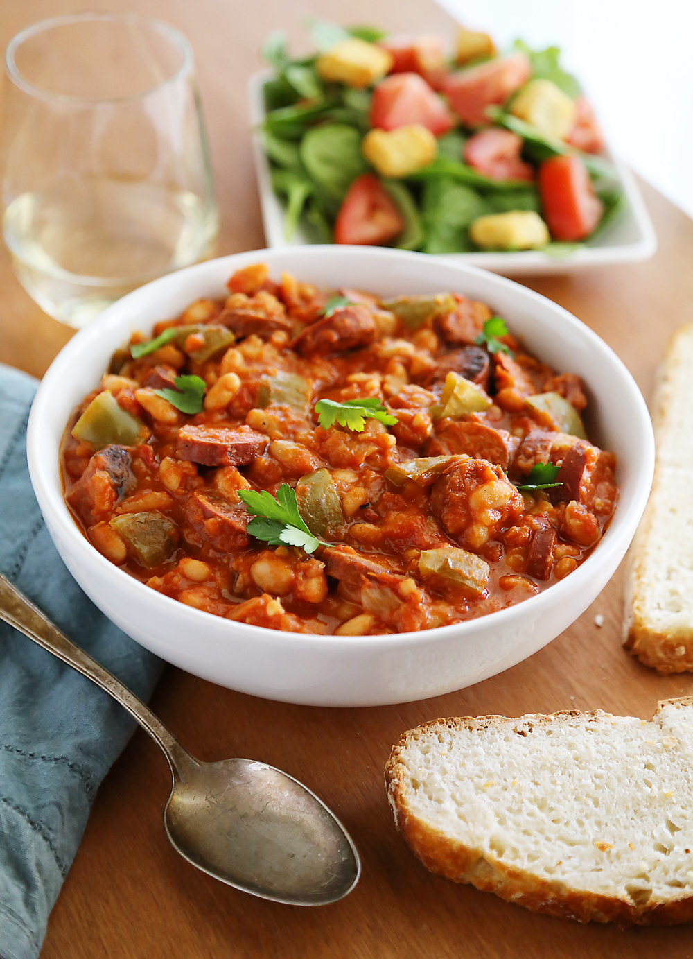 Slow Cooker Sausage, Peppers and White Beans – Hearty, healthy 6-ingredient/one-pot dish in a rich tomato sauce. So easy and delish with a salad! thecomfortofcooking.com
