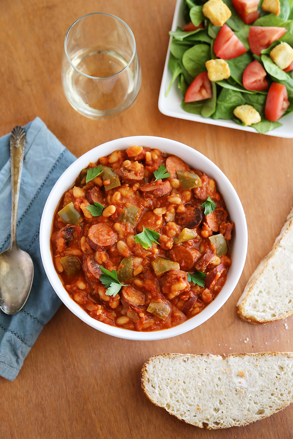 Slow Cooker Sausage, Peppers and White Beans – Hearty, healthy 6-ingredient/one-pot dish in a rich tomato sauce. So easy and delish with a salad! thecomfortofcooking.com