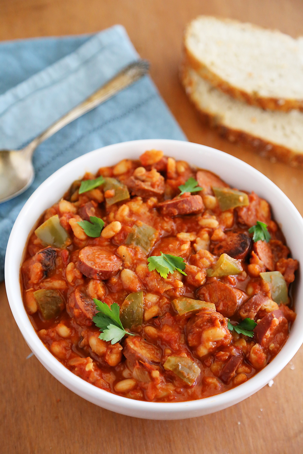 Slow Cooker Sausage, Peppers and White Beans – Hearty, healthy 6-ingredient/one-pot dish in a rich tomato sauce. So easy and delish with a salad! thecomfortofcooking.com