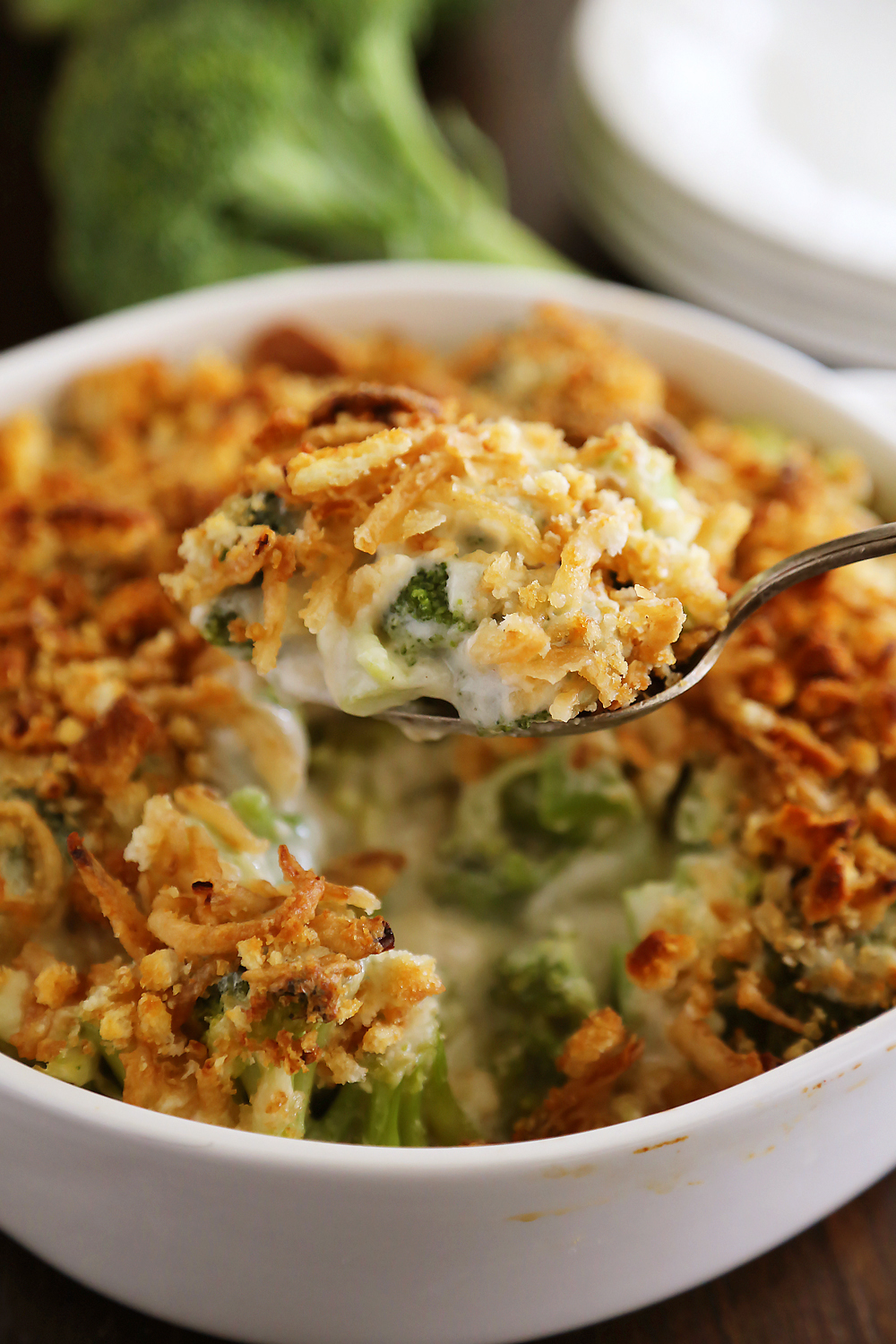 Broccoli Cheddar Gratin with Crispy Onions – Classic, easy broccoli and cheddar casserole topped with crushed croutons and crispy fried onions. Thecomfortofcooking.com