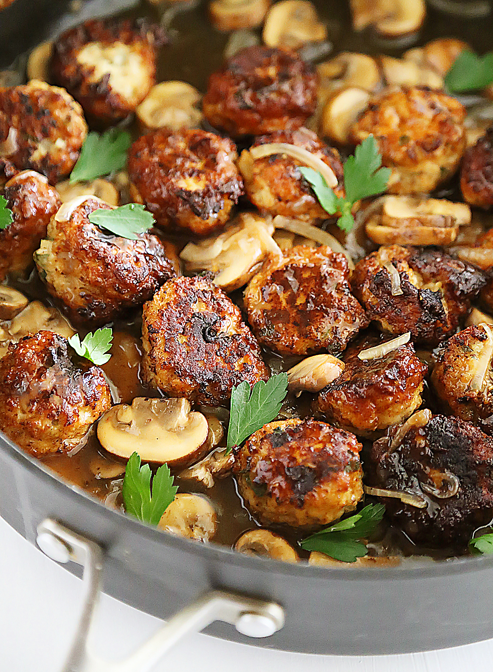 Chicken Marsala Meatballs – So tender and flavorful! Crispy, juicy meatballs with mushrooms in a tangy Marsala sauce. Thecomfortofcooking.com