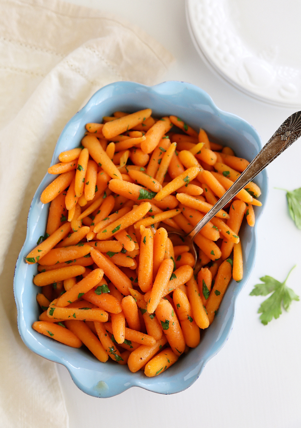 Honey-Glazed Baby Carrots – Tender crisp carrots with butter, brown sugar and nutmeg make a perfect one-skillet side! | thecomfortofcooking.com