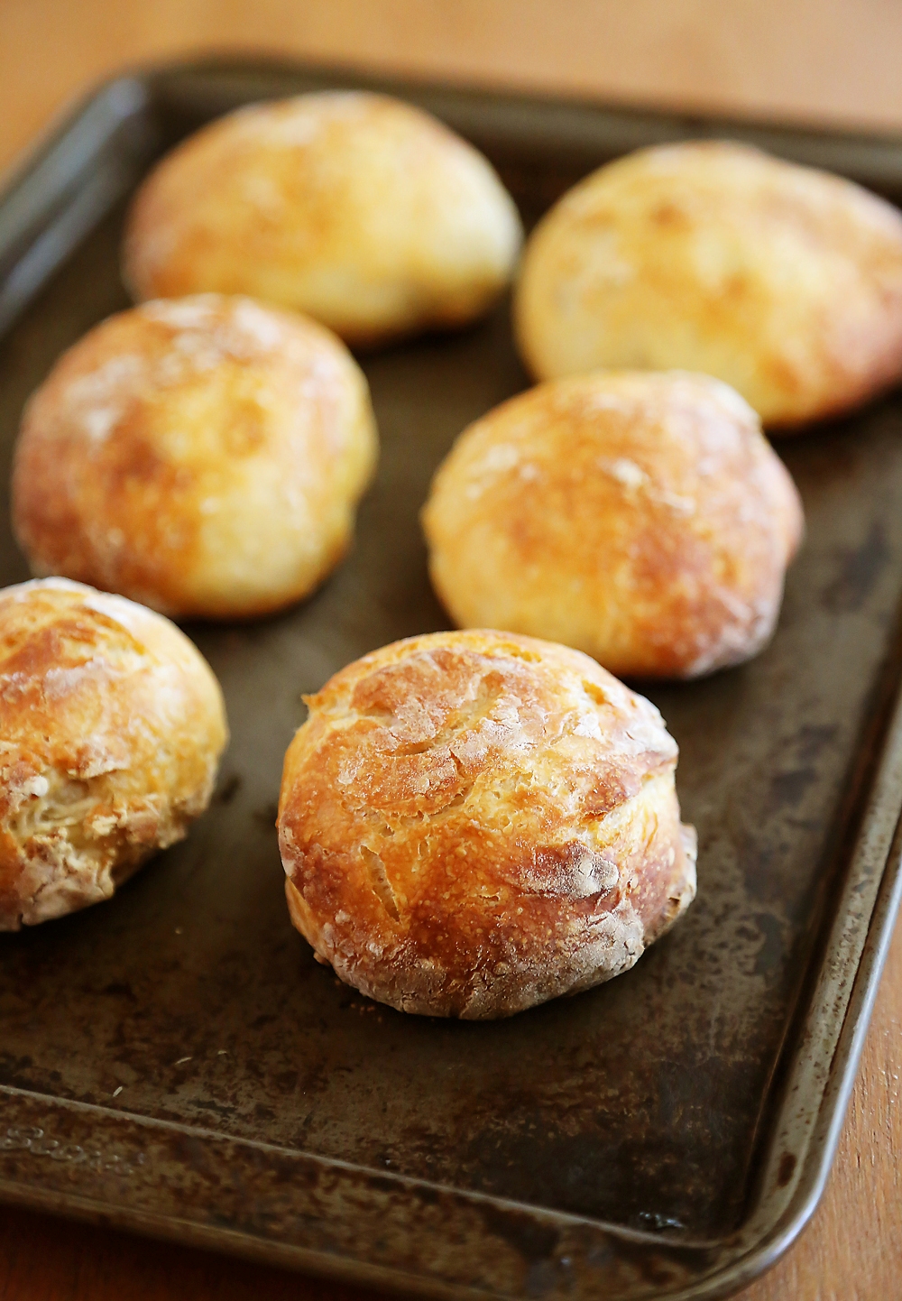 No-Knead Crusty Artisan Mini Loaves – So crusty, fluffy, and EASY! Just 3 ingredients and 5 minutes for these homemade loaves. thecomfortofcooking.com 