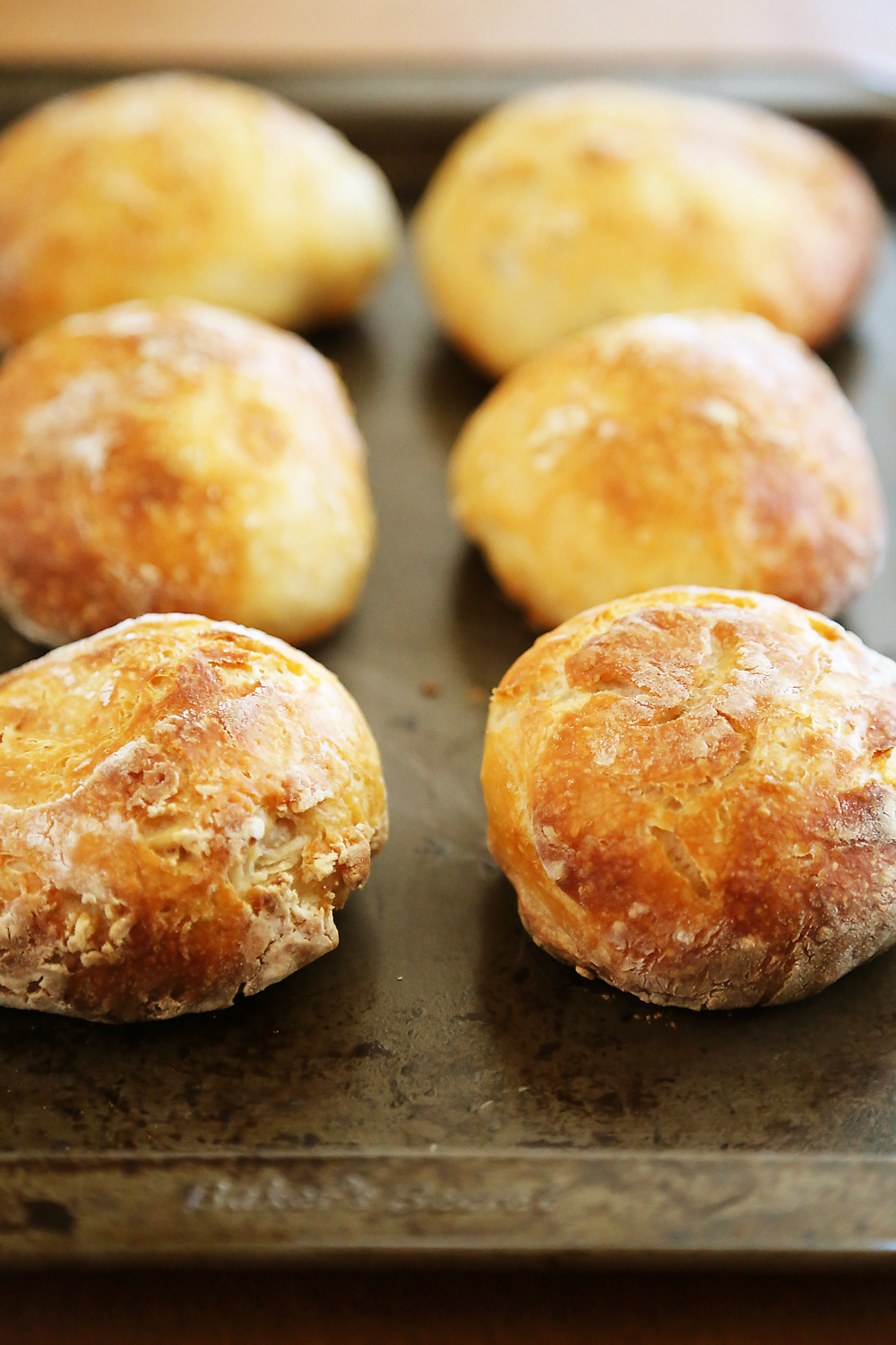 No-Knead Crusty Artisan Mini Loaves – So crusty, fluffy, and EASY! Just 3 ingredients and 5 minutes for these homemade loaves. thecomfortofcooking.com 