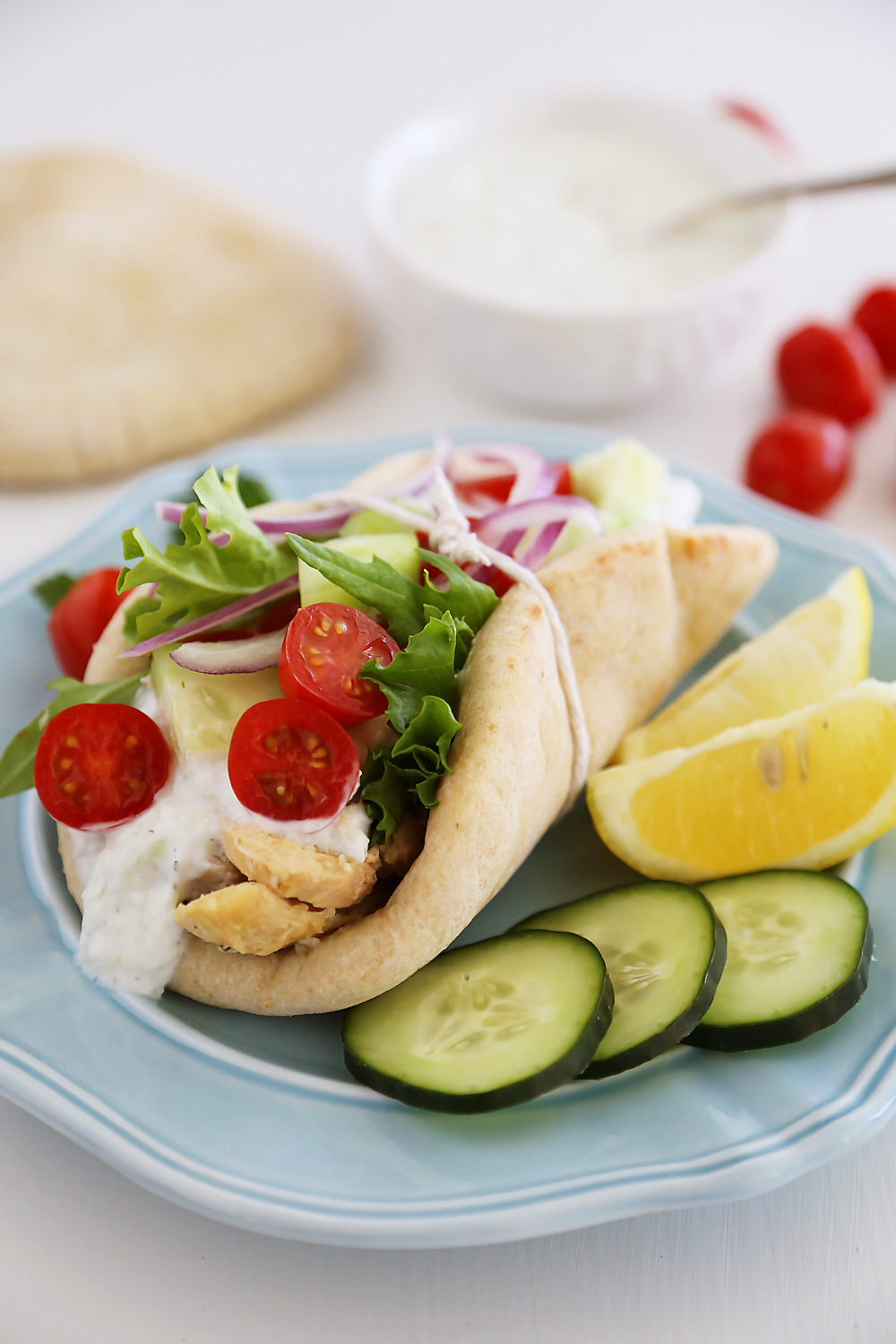 Slow Cooker Chicken Gyros with Tzatziki Sauce - Just like your favorite Greek takeout, but 10x more fresh and flavorful! Thecomfortofcooking.com