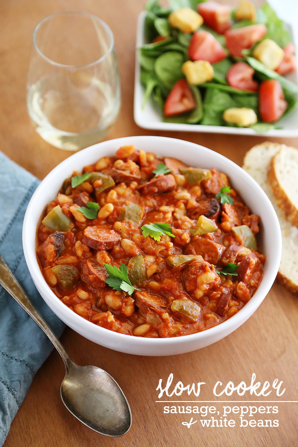 Slow Cooker Sausage, Peppers and White Beans – Hearty, healthy 6-ingredient/one-pot dish in a rich tomato sauce. So easy and delish with a salad! thecomfortofcooking.com