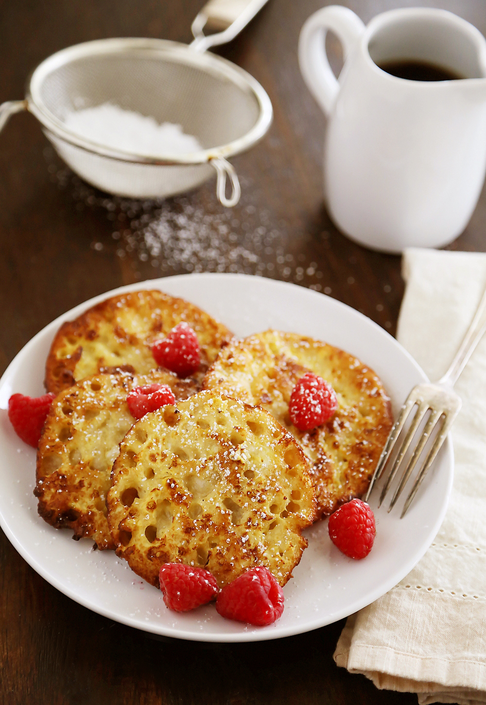 English Muffin French Toast - Fluffy, buttery French toast made from English muffins + topped with berries! Thecomfortofcooking.com