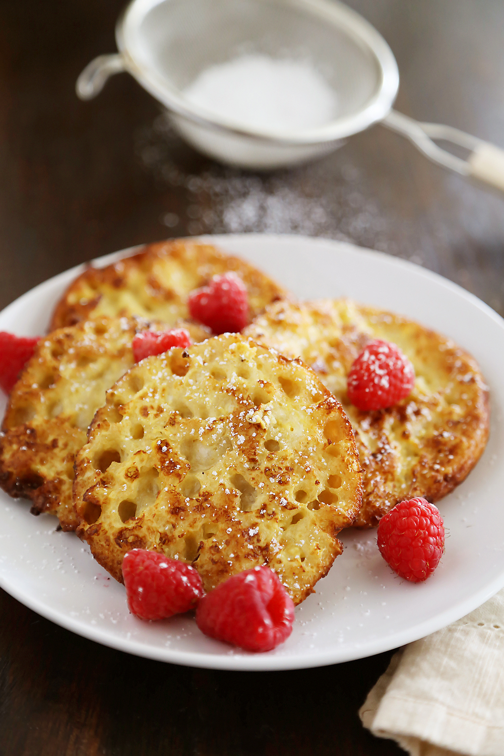 English Muffin French Toast - Fluffy, buttery French toast made from English muffins + topped with berries! Thecomfortofcooking.com