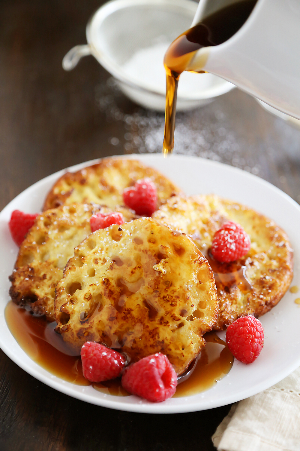 English Muffin French Toast - Fluffy, buttery French toast made from English muffins + topped with berries! Thecomfortofcooking.com