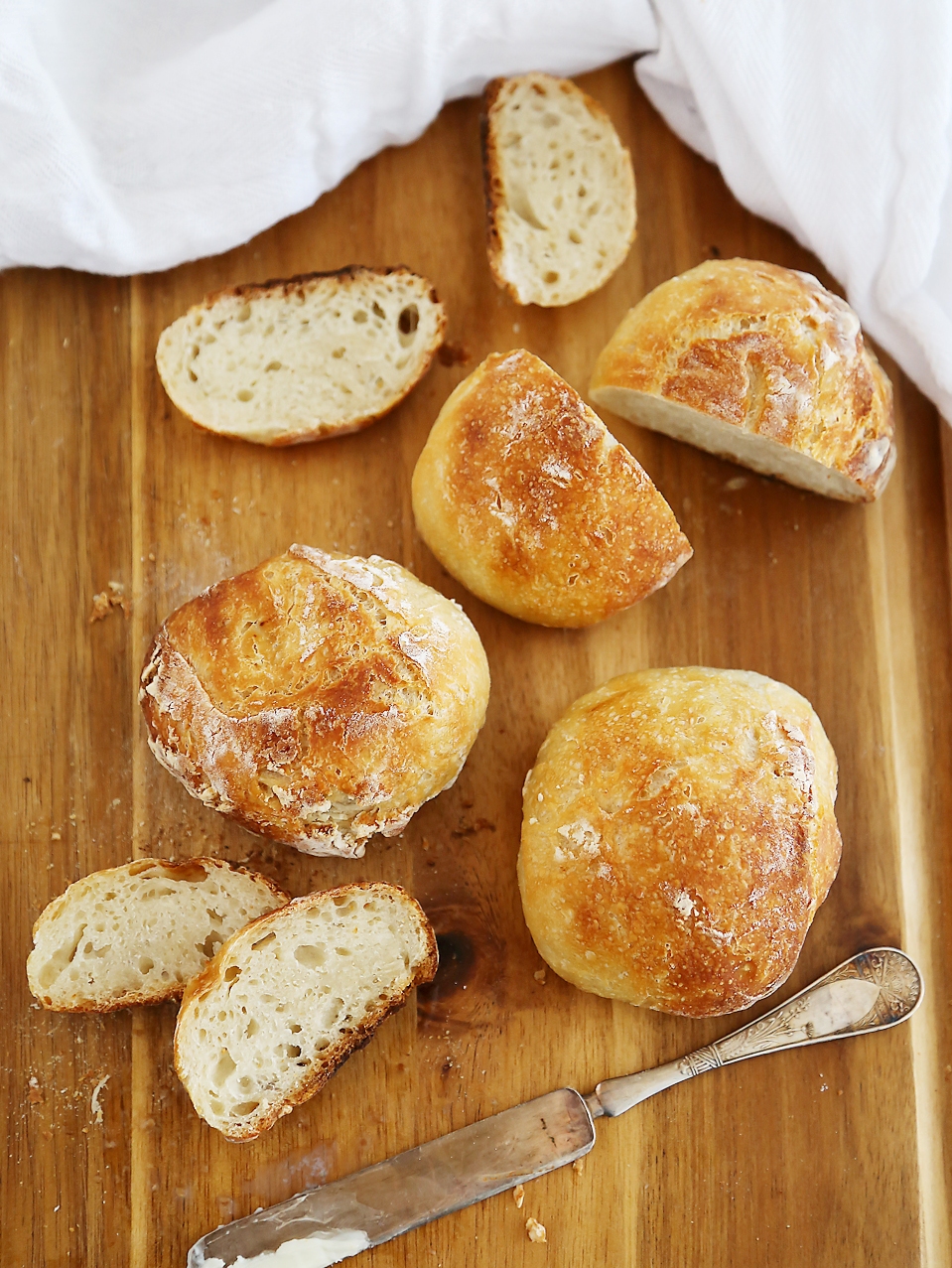 No-Knead Crusty Artisan Mini Loaves – So crusty, fluffy, and EASY! Just 3 ingredients and 5 minutes for these homemade loaves. thecomfortofcooking.com 
