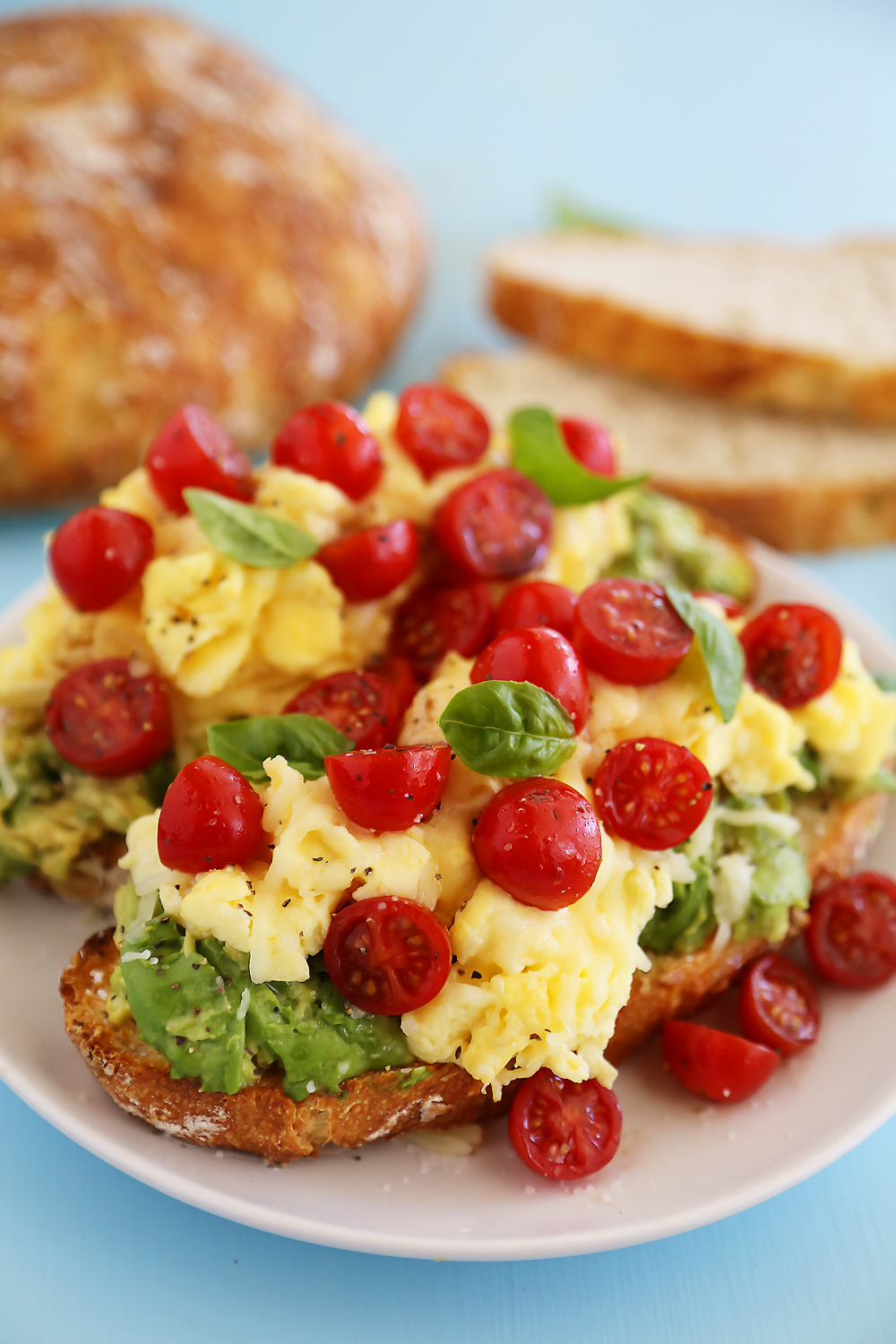 Scrambled Egg Caprese Avocado Toast - Hearty, healthy and full of fresh flavors! Thecomfortofcooking.com