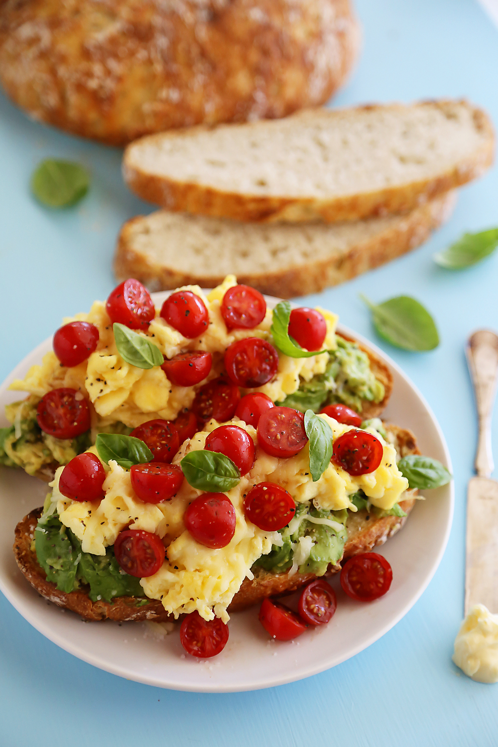 Scrambled Egg Caprese Avocado Toast - Hearty, healthy and full of fresh flavors! Thecomfortofcooking.com