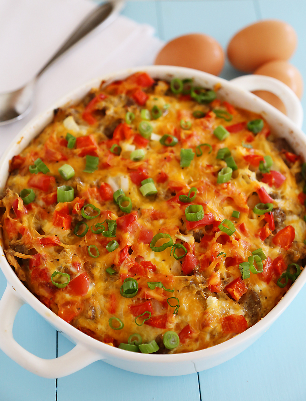 English Muffin Sausage, Egg and Cheese Breakfast Casserole – So delicious and easy! Topped with salty sausage, scrambled eggs and cheddar. thecomfortofcooking.com