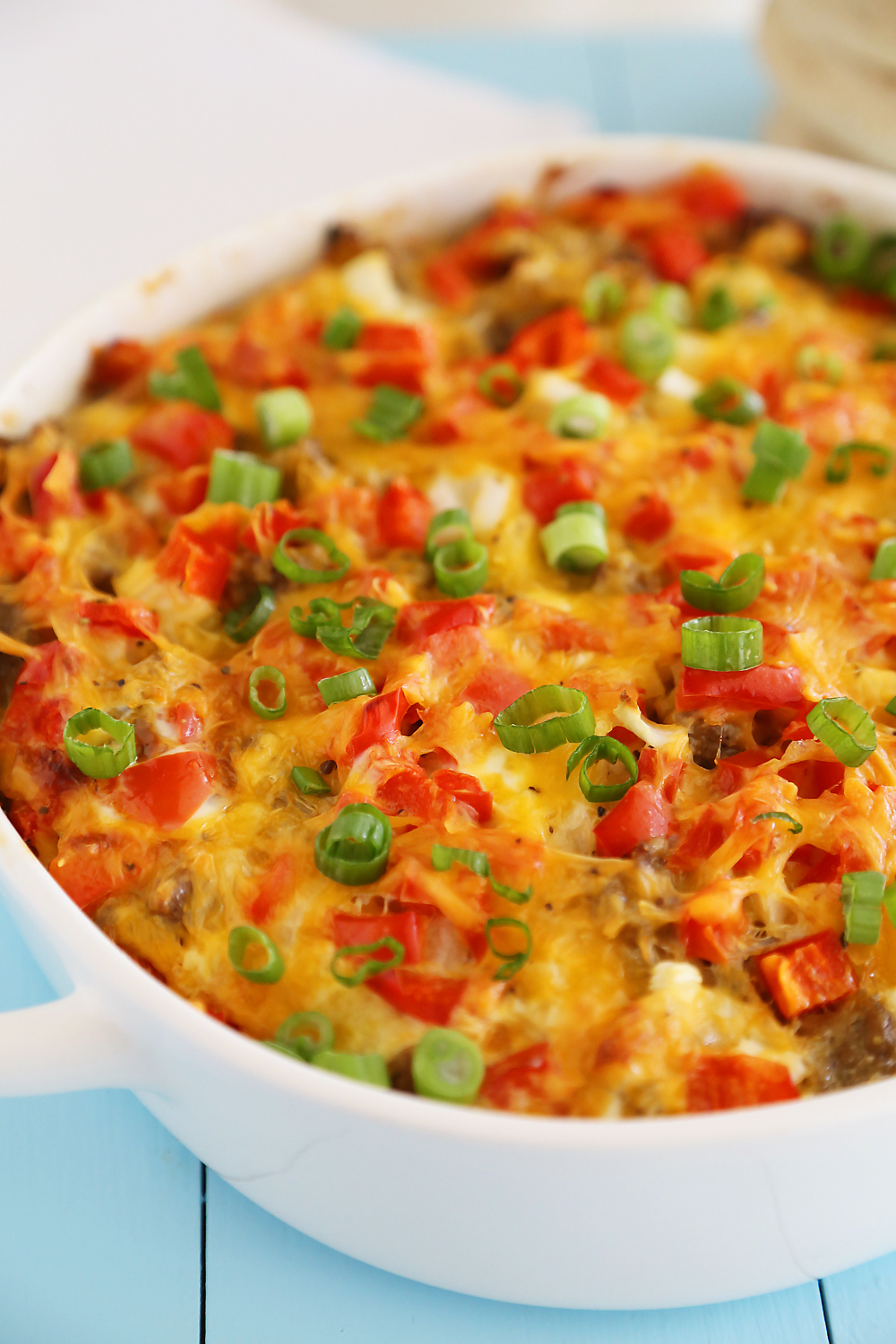 English Muffin Sausage, Egg and Cheese Breakfast Casserole – So delicious and easy! Topped with salty sausage, scrambled eggs and cheddar. thecomfortofcooking.com