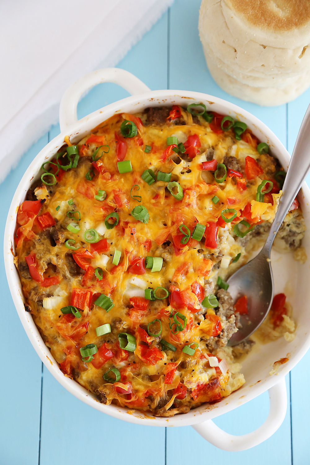 English Muffin Sausage, Egg and Cheese Breakfast Casserole – So delicious and easy! Topped with salty sausage, scrambled eggs and cheddar. thecomfortofcooking.com