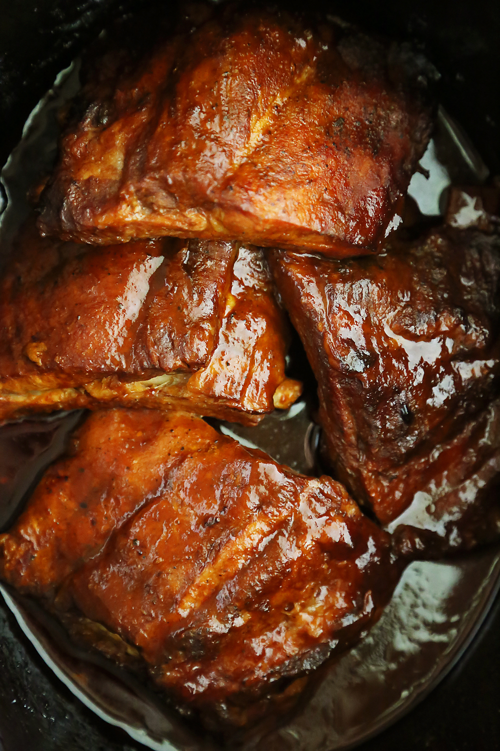 Slow Cooker Root Beer Baby Back Ribs - Tangy, tender and fall-off-the-bone good! Just 3 ingredients and made easily in your slow cooker. Thecomfortofcooking.com