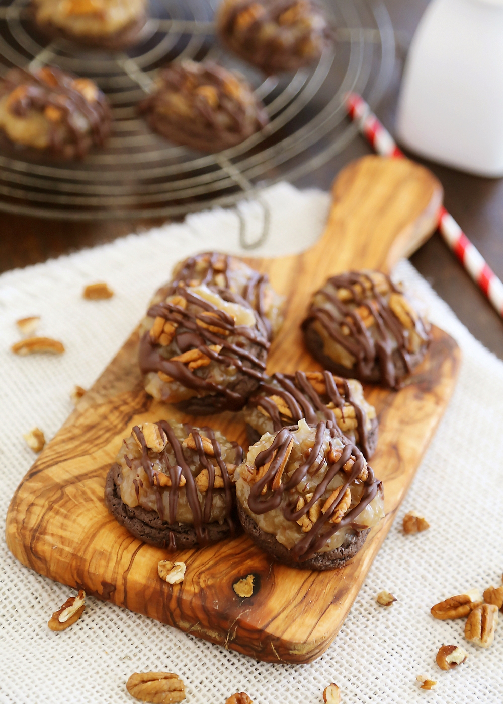 Gooey German Chocolate Cake Cookies - Rich, chocolaty cookies topped with decadent caramel-coated pecans, coconut and chocolate chips! Thecomfortofcooking.com