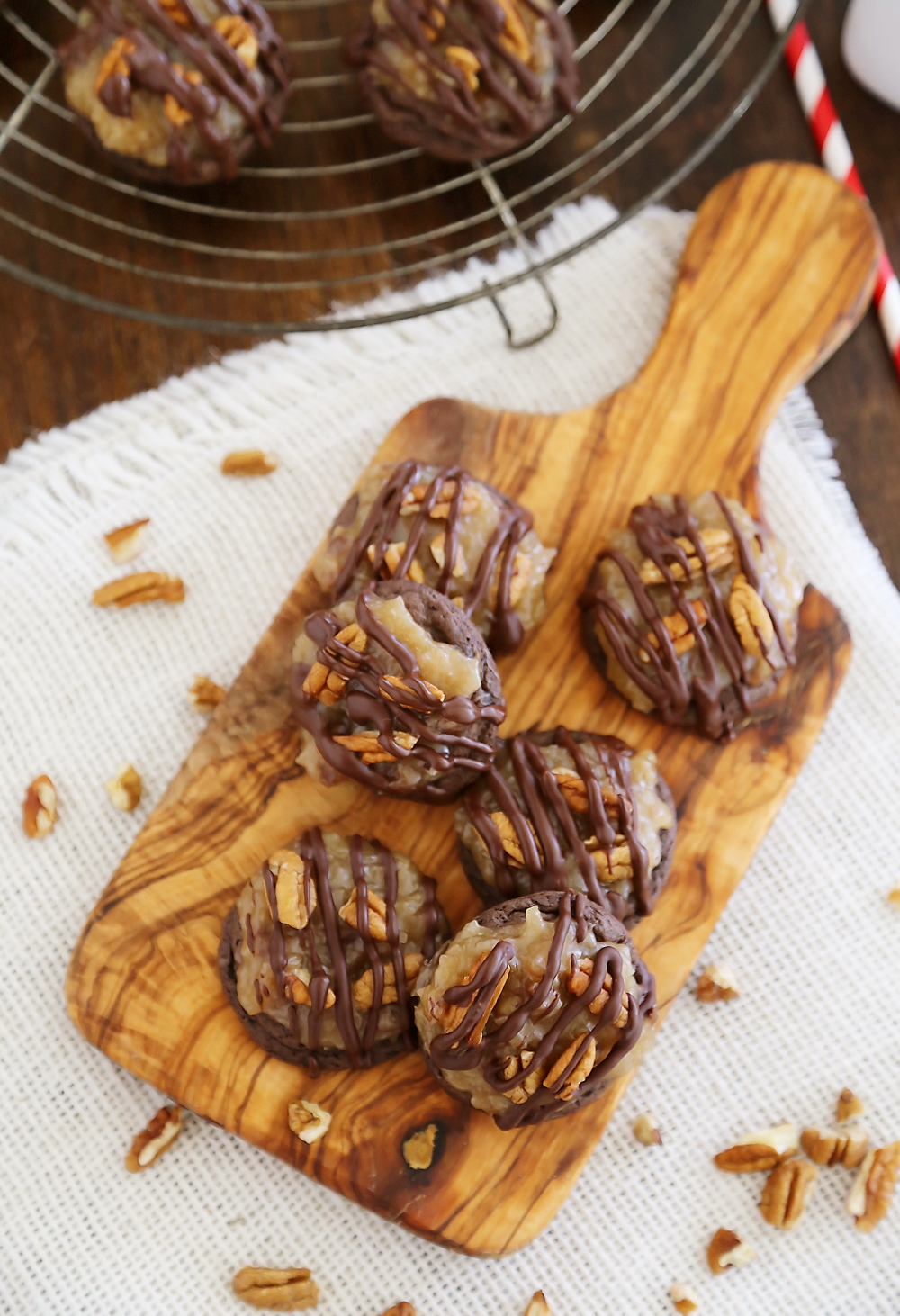 Gooey German Chocolate Cake Cookies - Rich, chocolaty cookies topped with decadent caramel-coated pecans, coconut and chocolate chips! Thecomfortofcooking.com