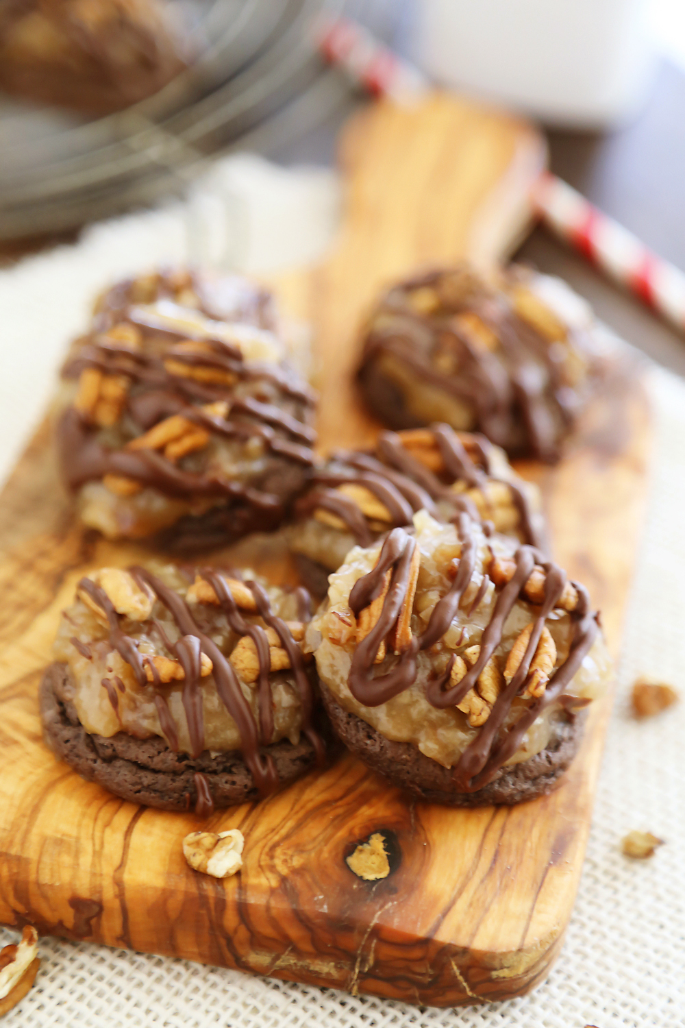 Gooey German Chocolate Cake Cookies - Rich, chocolaty cookies topped with decadent caramel-coated pecans, coconut and chocolate chips! Thecomfortofcooking.com