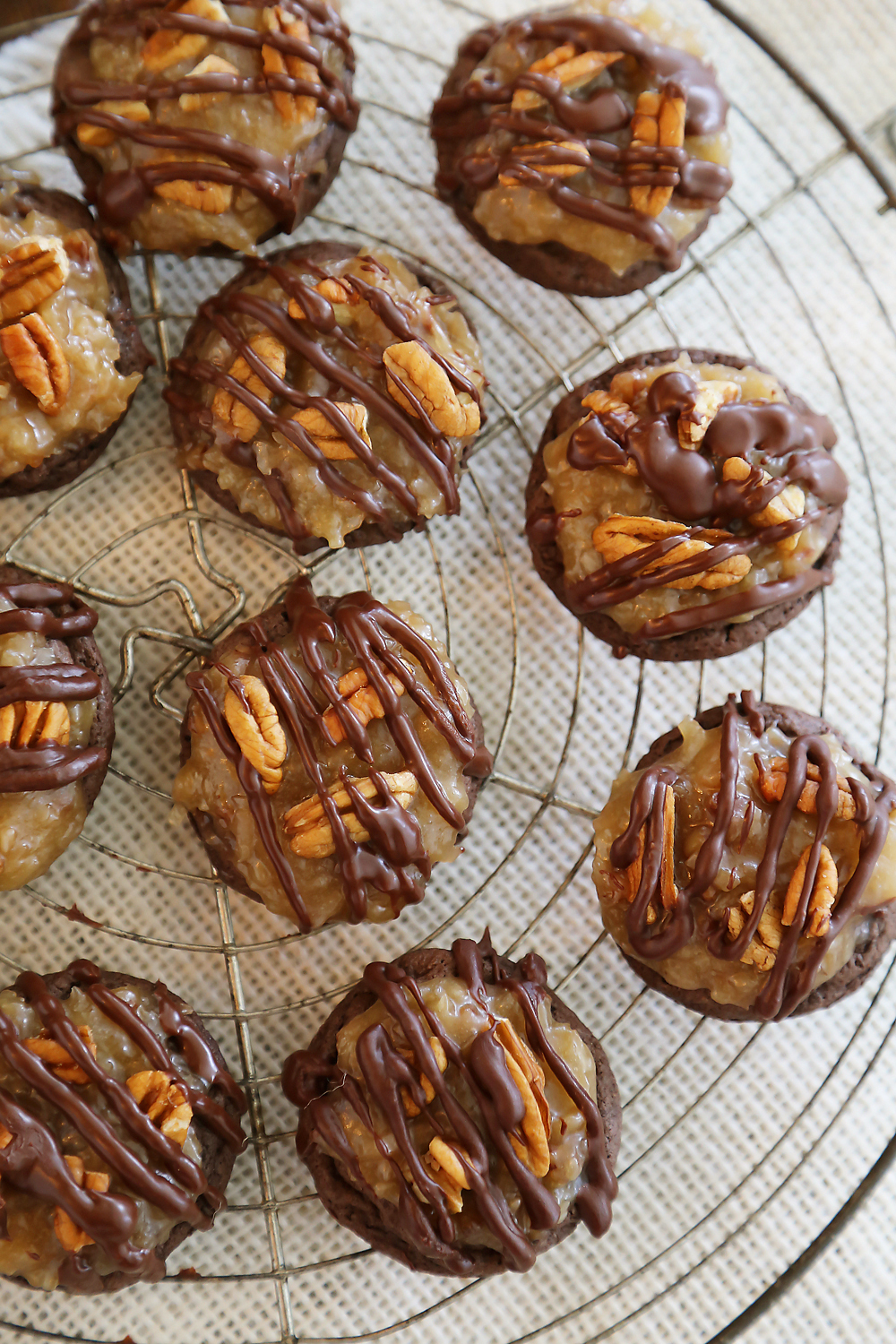 Gooey German Chocolate Cake Cookies - Rich, chocolaty cookies topped with decadent caramel-coated pecans, coconut and chocolate chips! Thecomfortofcooking.com