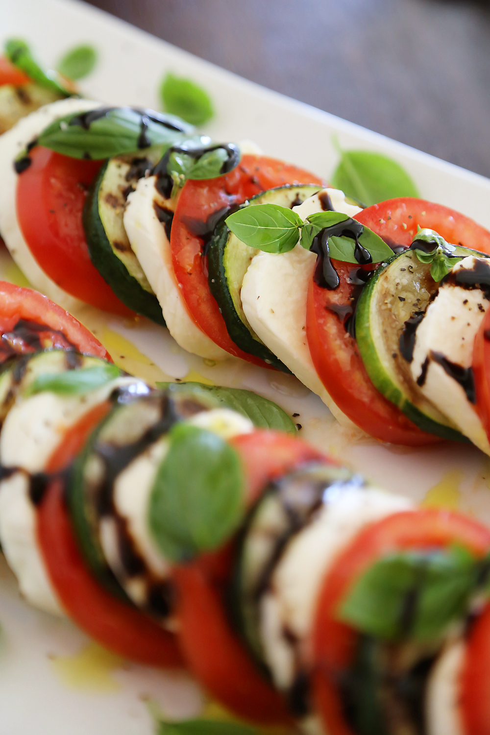 Grilled Zucchini Caprese Salad - Colorful, healthy, quick and easy. Serve alongside your favorite grilled meats and fish! Thecomfortofcooking.com