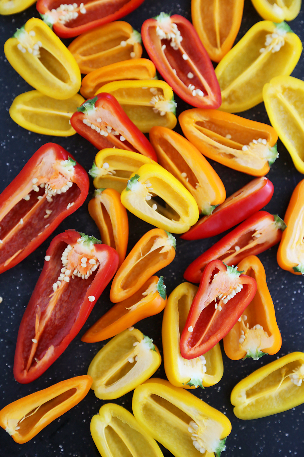 Mini Taco Stuffed Peppers with Cilantro Cream Sauce - Easy 5-ingredient spicy taco stuffed peppers with a creamy cool sauce. Thecomfortofcooking.com