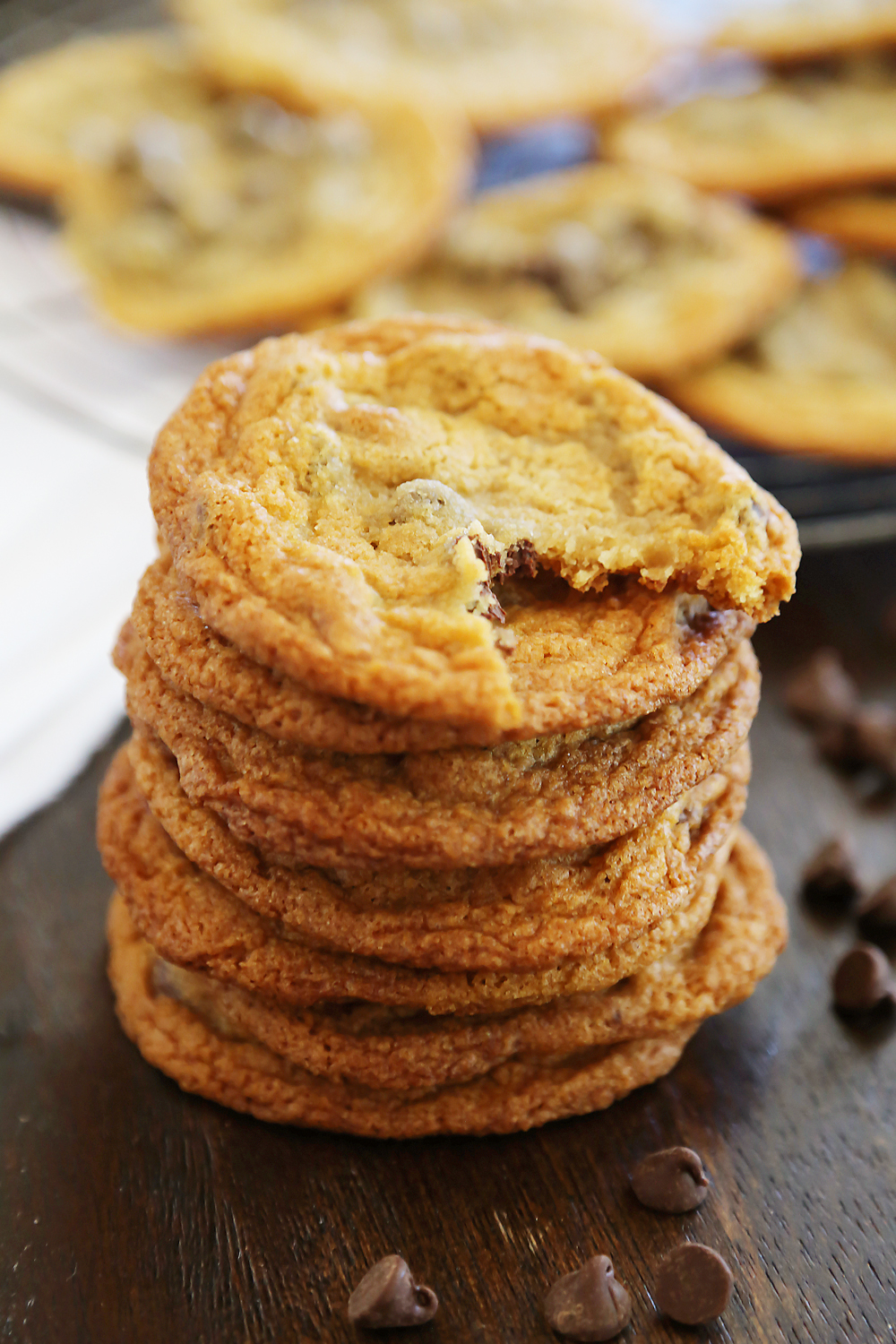 Thin and Chewy Chocolate Chip Cookies – Super buttery, chewy and irresistibly easy. Bake up a batch today! thecomfortofcooking.com