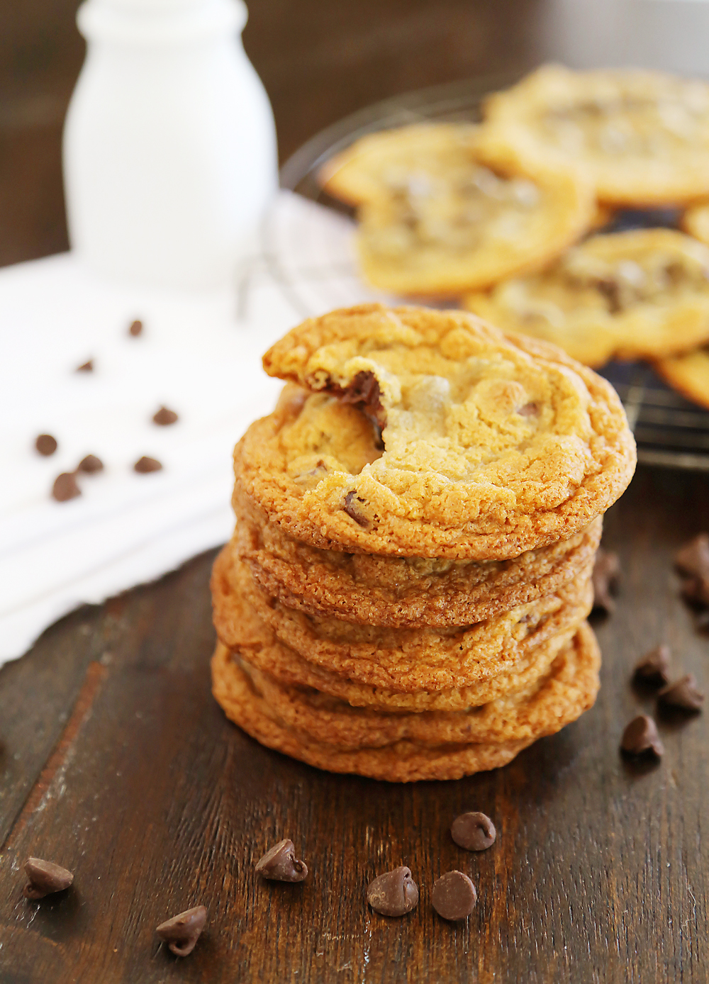 Thin and Chewy Chocolate Chip Cookies – Super buttery, chewy and irresistibly easy. Bake up a batch today! thecomfortofcooking.com