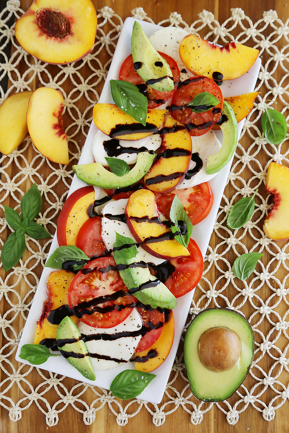 Peach and Avocado Caprese Salad - Salty, sweet, tangy and fresh! So easy and delicious with crusty bread + salad. Thecomfortofcooking.com