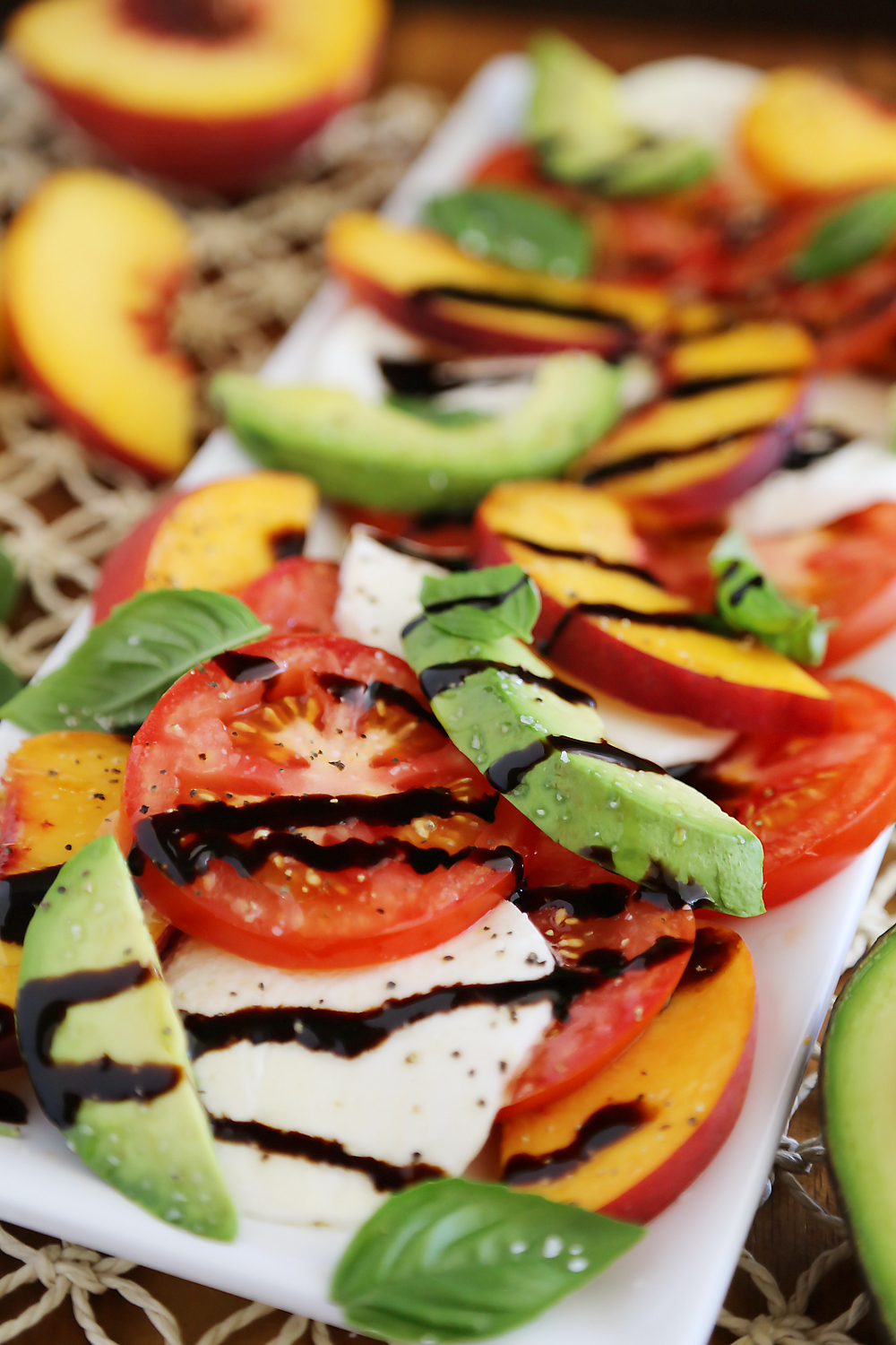 Peach and Avocado Caprese Salad - Salty, sweet, tangy and fresh! So easy and delicious with crusty bread + salad. Thecomfortofcooking.com