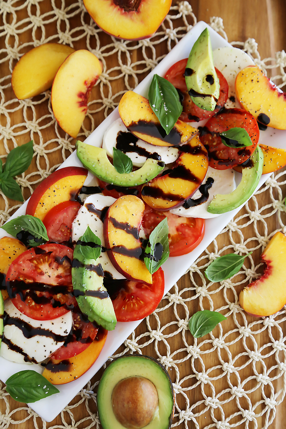 Peach and Avocado Caprese Salad - Salty, sweet, tangy and fresh! So easy and delicious with crusty bread + salad. Thecomfortofcooking.com