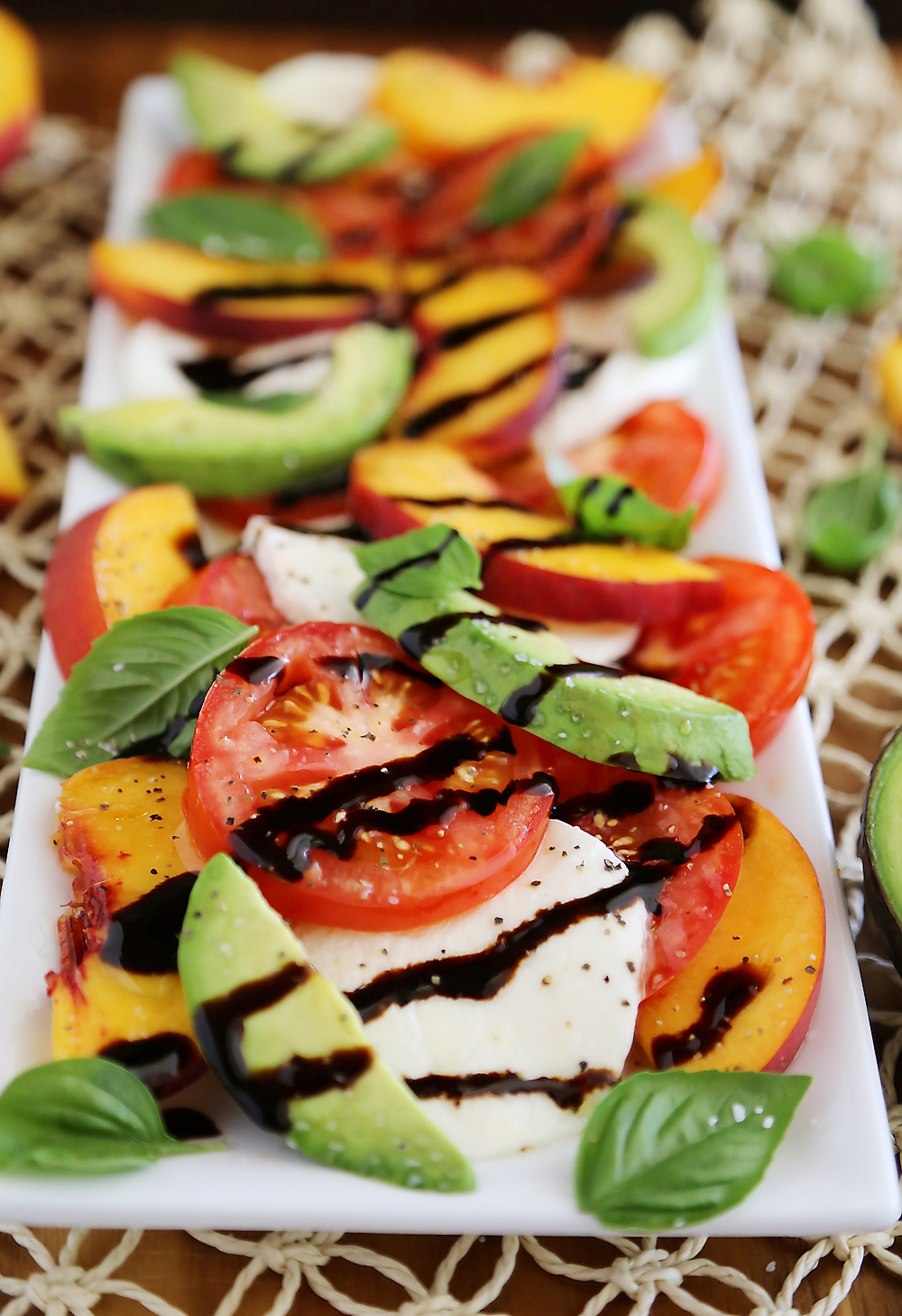 Peach and Avocado Caprese Salad - Salty, sweet, tangy and fresh! So easy and delicious with crusty bread + salad. Thecomfortofcooking.com