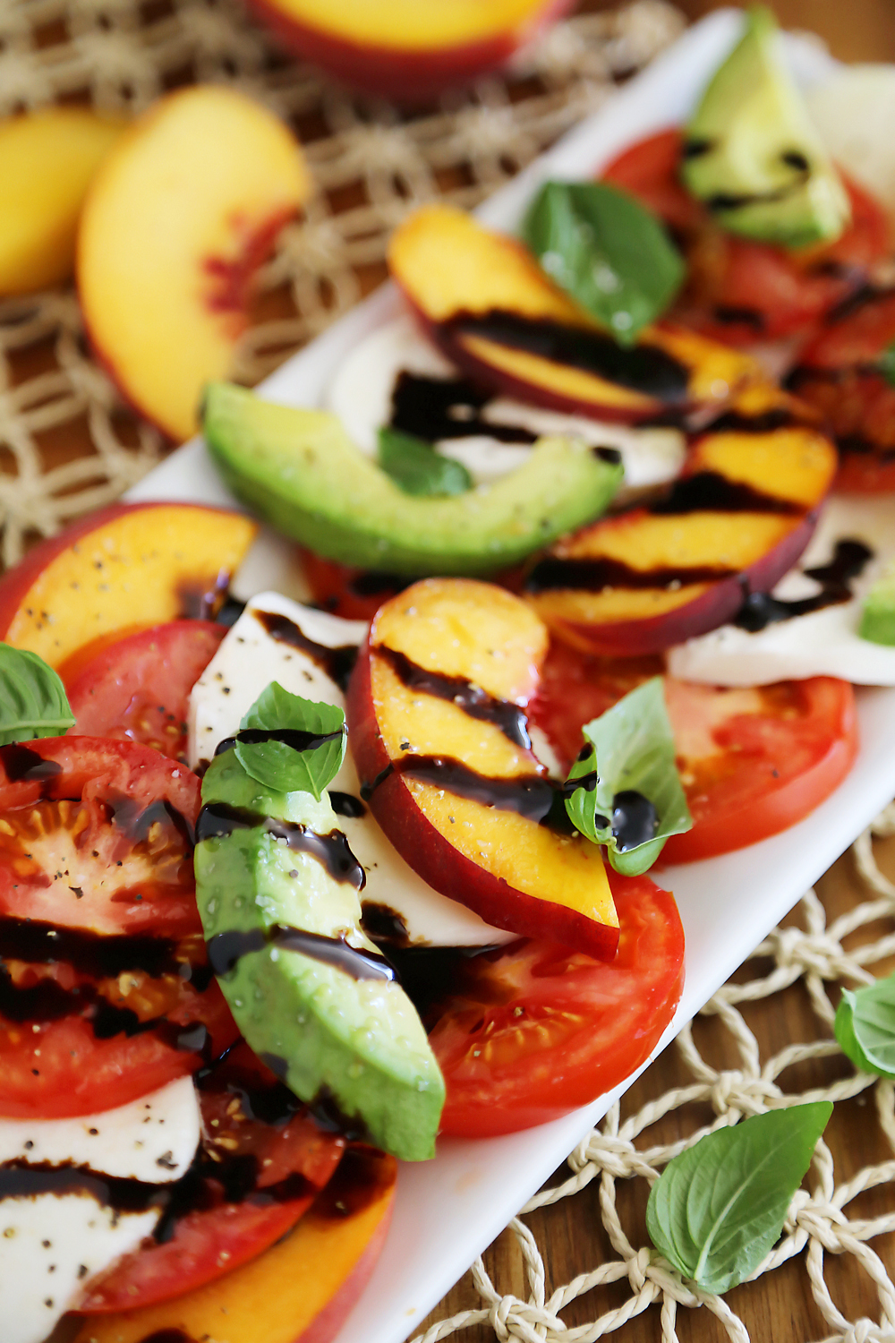 Peach and Avocado Caprese Salad - Salty, sweet, tangy and fresh! So easy and delicious with crusty bread + salad. Thecomfortofcooking.com