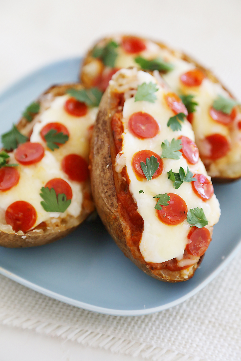 Pepperoni Pizza Potato Skins - Hearty, crispy potato skins meet cheesy pepperoni pizza! A perfect party appetizer. Thecomfortofcooking.com