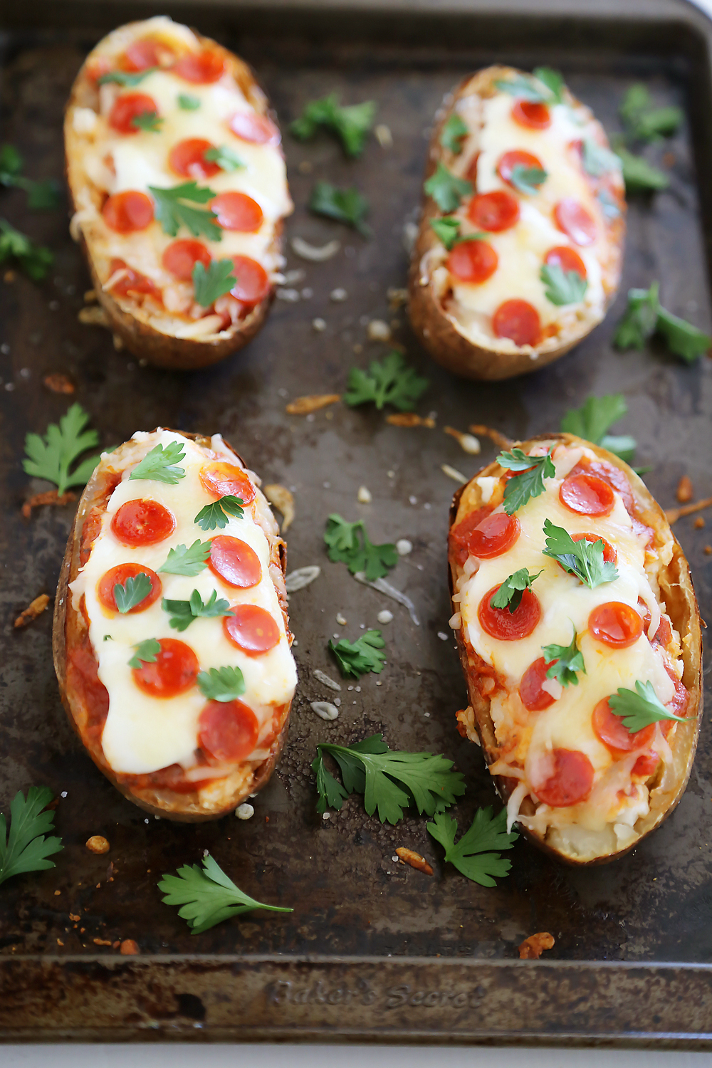 Pepperoni Pizza Potato Skins - Hearty, crispy potato skins meet cheesy pepperoni pizza! A perfect party appetizer. Thecomfortofcooking.com