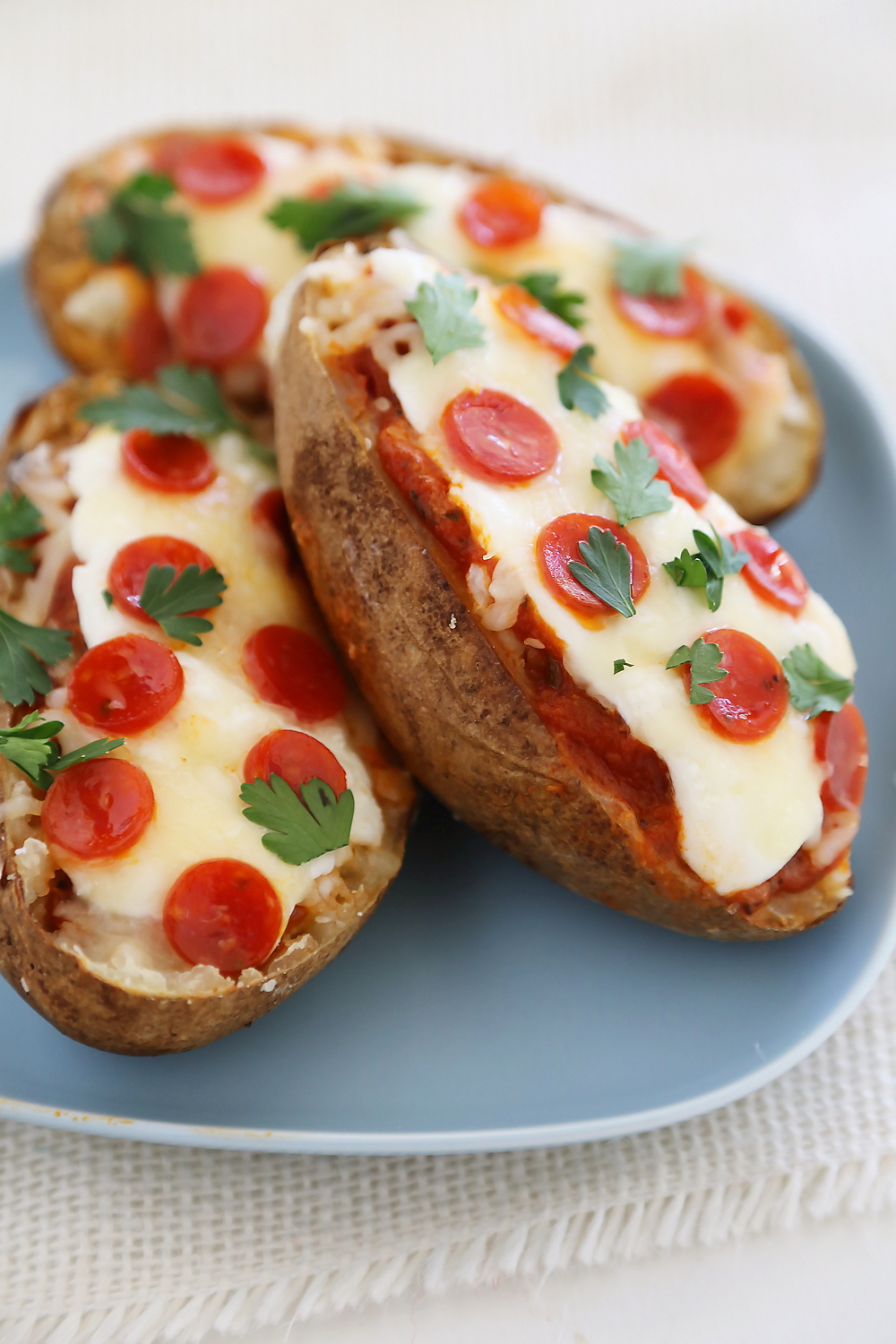 Pepperoni Pizza Potato Skins - Hearty, crispy potato skins meet cheesy pepperoni pizza! A perfect party appetizer. Thecomfortofcooking.com