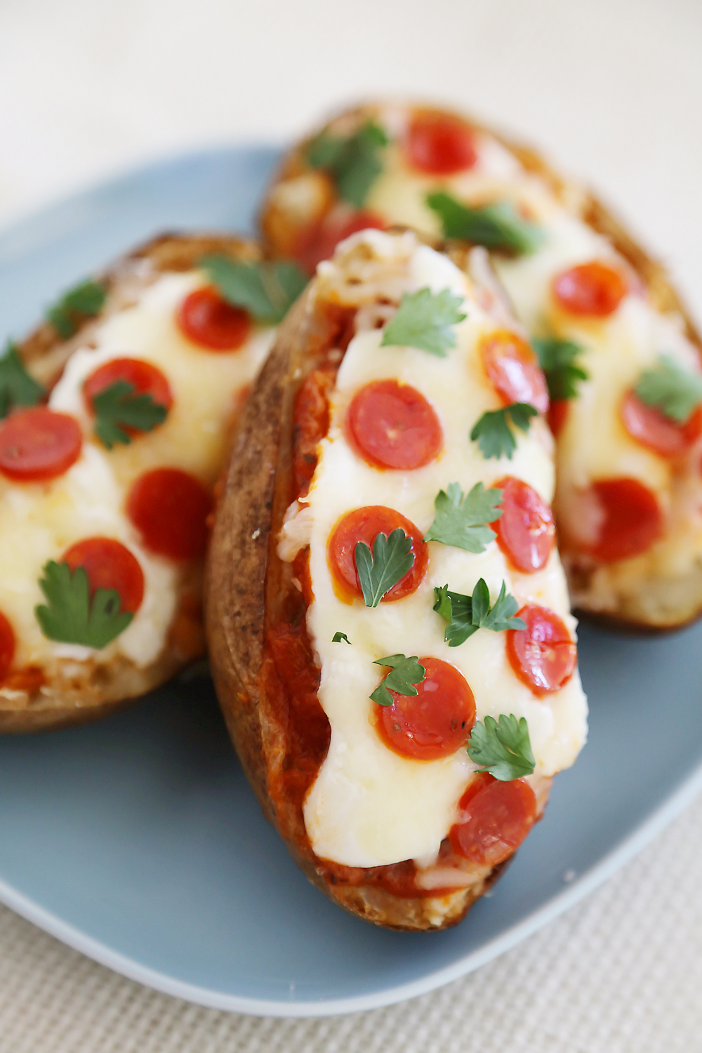 Pepperoni Pizza Potato Skins - Hearty, crispy potato skins meet cheesy pepperoni pizza! A perfect party appetizer. Thecomfortofcooking.com