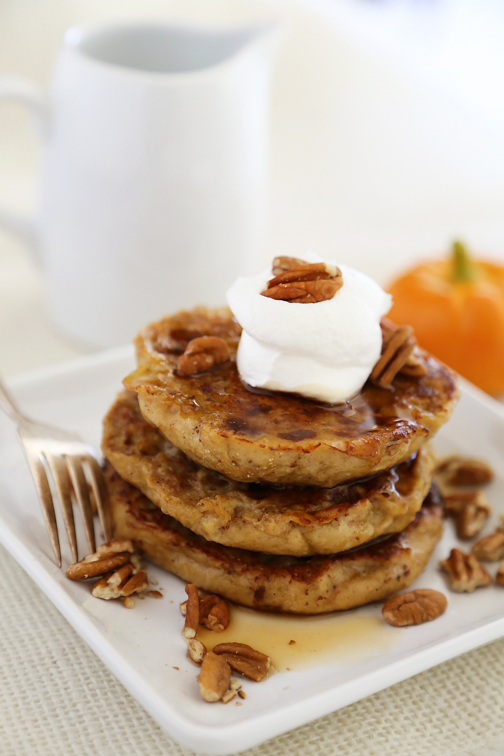 Pumpkin Vanilla English Muffin French Toast - Fluffy, buttery French toast made with pumpkin spice English muffins, vanilla, cinnamon and nutmeg! Thecomfortofcooking.com