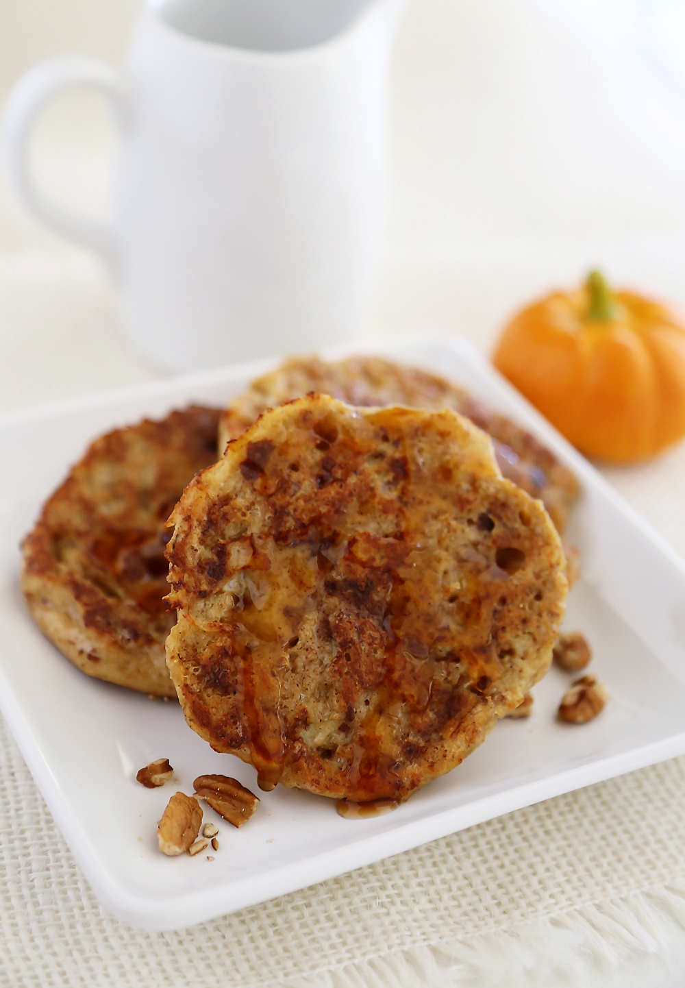 Pumpkin Vanilla English Muffin French Toast - Fluffy, buttery French toast made with pumpkin spice English muffins, vanilla, cinnamon and nutmeg! Thecomfortofcooking.com